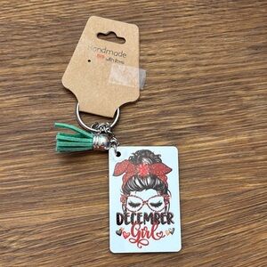 Handmade December Girl Keychain with Green Tassel